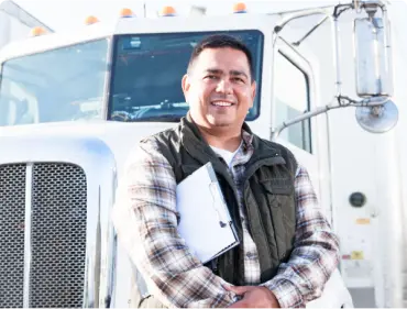 Small Trucking Company Owner in front of truck