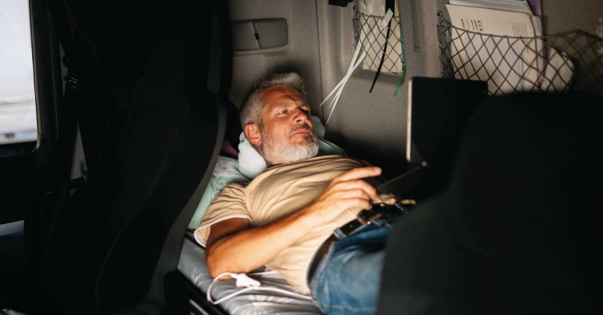 APU-in-cab2 Trucker lying down watching TV in the truck with an APU